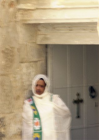 Israel, Jerusalem, woman in front of church doorway, blurry. Stock Photo - Premium Royalty-Free, Code: 696-03399767