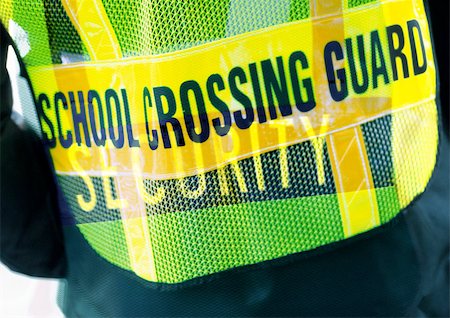 police officer at school crossing - School Crossing Guard typography on security vest, montage Stock Photo - Premium Royalty-Free, Code: 696-03399818