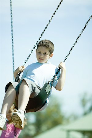 Child on swing Stock Photo - Premium Royalty-Free, Code: 696-03393981