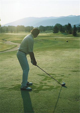 simsearch:632-01153250,k - Golfer preparing to swing Stock Photo - Premium Royalty-Free, Code: 696-03400065