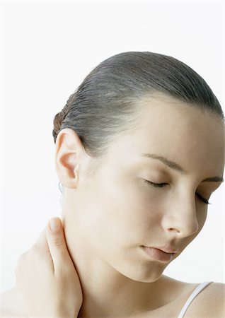 simsearch:695-05769616,k - Woman with hand on neck and eyes closed Stock Photo - Premium Royalty-Free, Code: 696-03400098