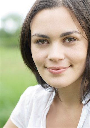 simsearch:632-01154783,k - Young woman smiling, portrait Stock Photo - Premium Royalty-Free, Code: 696-03400284