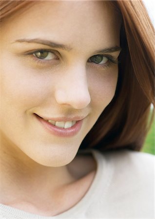 simsearch:696-03400445,k - Young woman with sly smile, portrait Stock Photo - Premium Royalty-Free, Code: 696-03400294