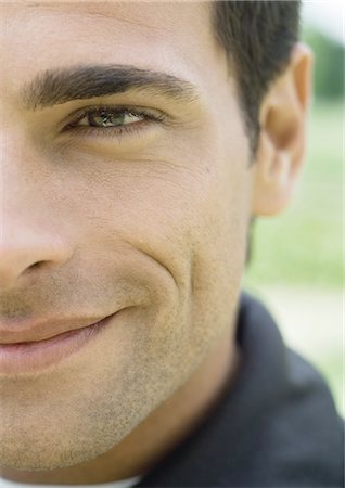 simsearch:632-01154783,k - Young man smiling, cropped, portrait Stock Photo - Premium Royalty-Free, Code: 696-03400295