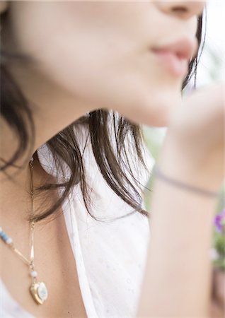 Woman blowing kiss, close-up Stock Photo - Premium Royalty-Free, Code: 696-03400387