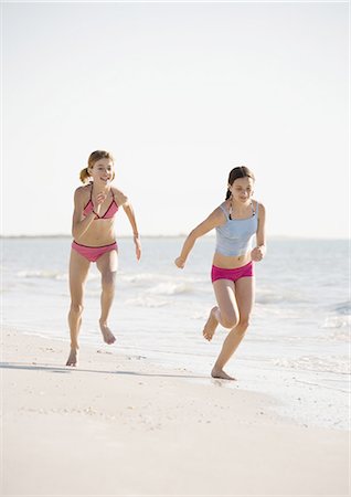 simsearch:632-02745223,k - Two preteen girls running on beach Stock Photo - Premium Royalty-Free, Code: 696-03400474