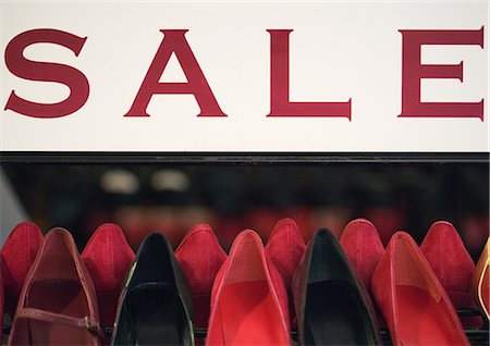 reduction - Sale sign over rack of shoes Stock Photo - Premium Royalty-Free, Code: 696-03400625