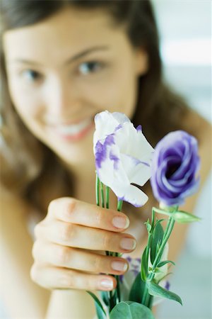 purple sensation - Young woman holding flowers Stock Photo - Premium Royalty-Free, Code: 696-03401408