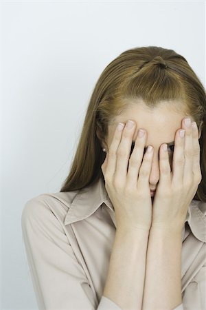 Teenage girl, hands over face, portrait Fotografie stock - Premium Royalty-Free, Codice: 696-03401470