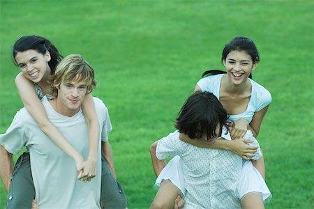 simsearch:693-06668076,k - Group of young friends, riding piggyback Stock Photo - Premium Royalty-Free, Code: 696-03401497