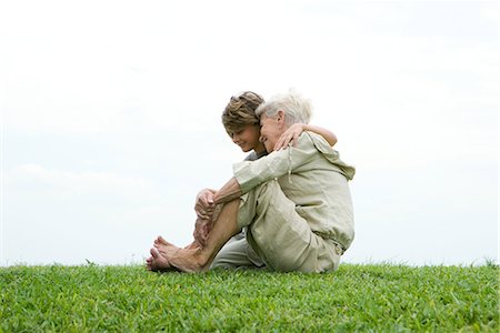 simsearch:696-03401990,k - Senior woman and grandson, sitting on grass, full length Stock Photo - Premium Royalty-Free, Code: 696-03401991