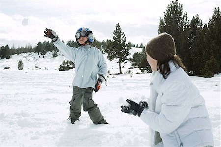 Young friends having snowball fight, action shot Stock Photo - Premium Royalty-Free, Code: 696-03402018