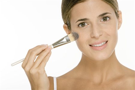 simsearch:649-07065006,k - Woman applying make-up Foto de stock - Sin royalties Premium, Código: 696-03402360