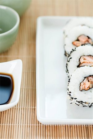 simsearch:693-06022131,k - Cropped view of four pieces of maki sushi with soy sauce Stock Photo - Premium Royalty-Free, Code: 696-03402770