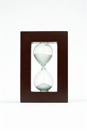 Hourglass in wooden frame Foto de stock - Sin royalties Premium, Código: 696-03402866