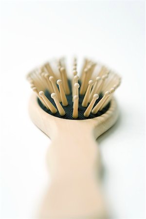simsearch:632-02416240,k - Wooden hairbrush, extreme close-up Stock Photo - Premium Royalty-Free, Code: 696-03402903