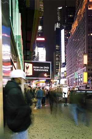 pictures of new york city buildings night - Sidewalk scene on Broadway in New York City looking north at Times Square Stock Photo - Premium Royalty-Free, Code: 696-03402987