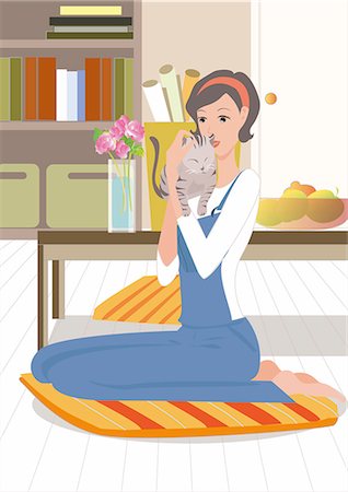 Woman holding a cat Stock Photo - Premium Royalty-Free, Code: 690-03202235