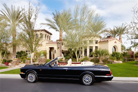simsearch:693-05552677,k - Black open roof car parked in front of mansion house Stock Photo - Premium Royalty-Free, Code: 693-05552678