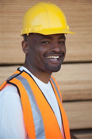 Portrait of a cheerful warehouse worker Stock Photo - Premium Royalty-Free, Code: 693-05552729