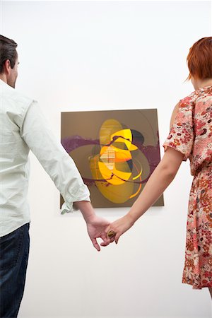 simsearch:693-05552770,k - Married couple holding hands in front of painting in art gallery Foto de stock - Sin royalties Premium, Código: 693-05552774