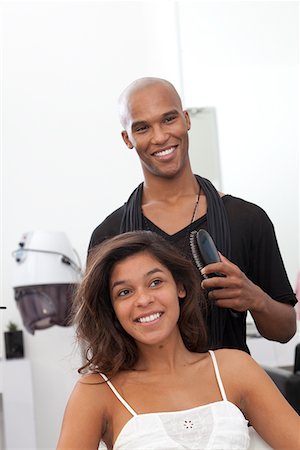 salon african american - Woman getting her hair styled at beauty salon Stock Photo - Premium Royalty-Free, Code: 693-05794094