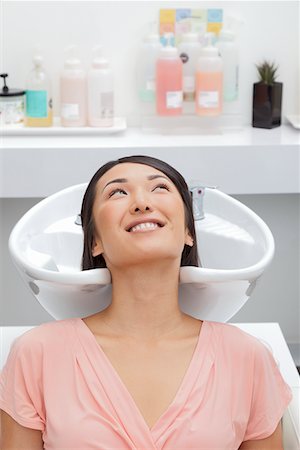 reclining bathing beauty - Woman getting her hair washed at beauty salon Stock Photo - Premium Royalty-Free, Code: 693-05794098