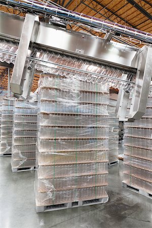 Stack of bottled water kept in warehouse Stock Photo - Premium Royalty-Free, Code: 693-05794203