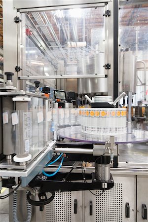 Bottling machine at bottling plant Stock Photo - Premium Royalty-Free, Code: 693-05794211