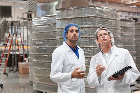 people in hairnets in factory - Quality control workers inspecting at bottling plant Stock Photo - Premium Royalty-Free, Code: 693-05794242