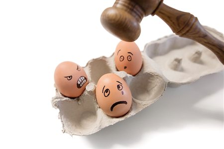 power idea - Funny faces on egg with gavel about to hit Stock Photo - Premium Royalty-Free, Code: 693-05794524