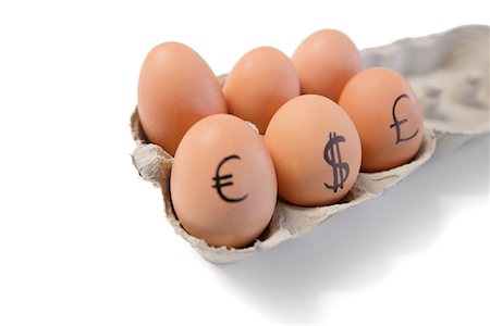 Eggs with currency symbols on it Fotografie stock - Premium Royalty-Free, Codice: 693-05794529