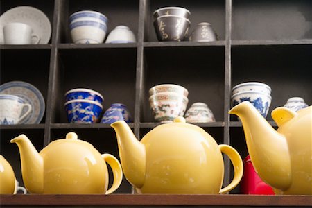 Low angle view of yellow tea kettles Stock Photo - Premium Royalty-Free, Code: 693-05794536