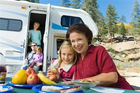 Three-generation family outside RV in campground Stock Photo - Premium Royalty-Free, Code: 693-06014034