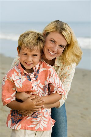 person in hawaiian shirt - Mother and Son on Beach Stock Photo - Premium Royalty-Free, Code: 693-06014055