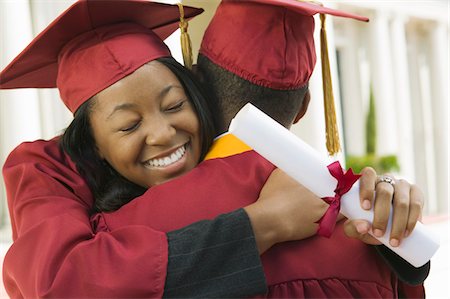 simsearch:693-06014222,k - Two graduates hugging outside Stock Photo - Premium Royalty-Free, Code: 693-06014151