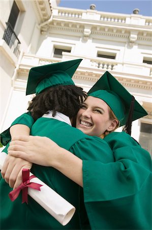 simsearch:693-06014222,k - Two graduates hugging outside university Stock Photo - Premium Royalty-Free, Code: 693-06014184