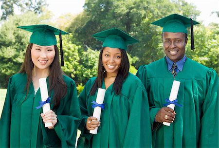 simsearch:693-06014222,k - Graduates hoisting diplomas outside university, portrait Stock Photo - Premium Royalty-Free, Code: 693-06014185