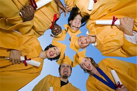 simsearch:693-06014222,k - Group of graduates holding diplomas outside, view from below Stock Photo - Premium Royalty-Free, Code: 693-06014220
