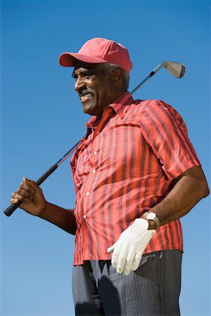 simsearch:693-03304456,k - Senior man holding golf club, (low angle view) Foto de stock - Sin royalties Premium, Código: 693-06014282