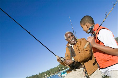 Grandfather and grandson fishing Stock Photo - Premium Royalty-Free, Code: 693-06014318