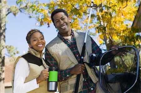 Portrait of woman with fishing gear Stock Photos - Page 1 : Masterfile