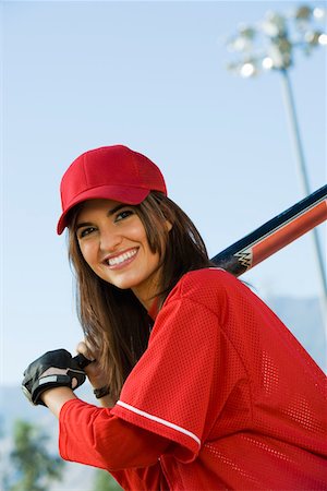 softball - Young woman with softball bat, portrait Fotografie stock - Premium Royalty-Free, Codice: 693-06014478