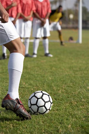 Soccer player taking free kick, low section Stock Photo - Premium Royalty-Free, Code: 693-06014503