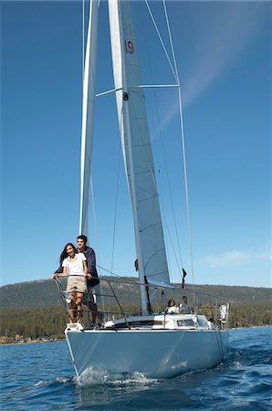 simsearch:693-06019372,k - Young couple standing on bow of sailboat Stock Photo - Premium Royalty-Free, Code: 693-06014604