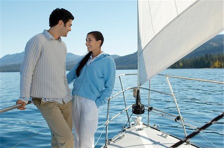 simsearch:693-06019372,k - Young couple standing on bow of sailboat Stock Photo - Premium Royalty-Free, Code: 693-06014609
