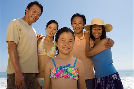 Family with girl (7-9) on beach, (portrait) Stock Photo - Premium Royalty-Free, Code: 693-06014722