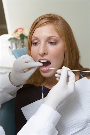 simsearch:693-06014951,k - Young woman having teeth examined at dentists Stock Photo - Premium Royalty-Free, Code: 693-06014936