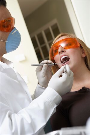 simsearch:693-06014951,k - Dentist examining womans teeth in surgery Stock Photo - Premium Royalty-Free, Code: 693-06014937