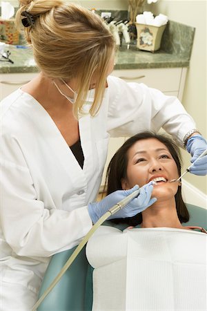 simsearch:693-06014951,k - Dentist examining female patient in surgery Stock Photo - Premium Royalty-Free, Code: 693-06014954